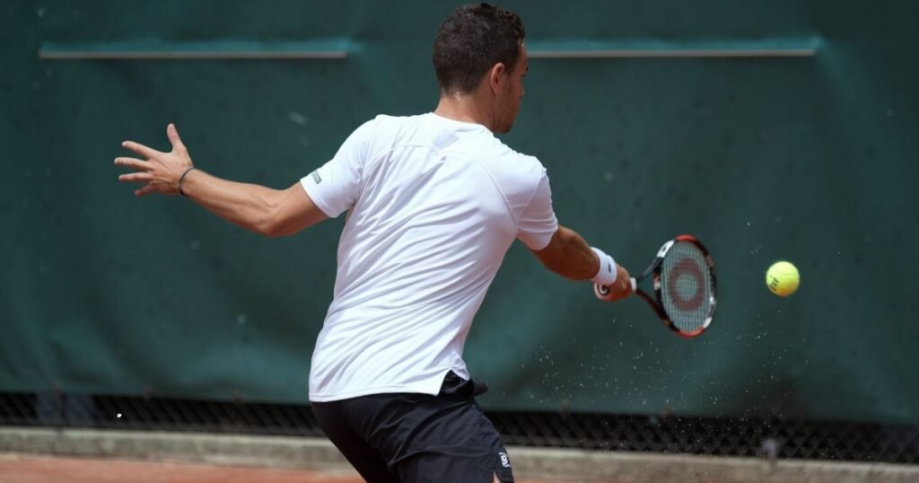 tennis player practicing wall drop shots